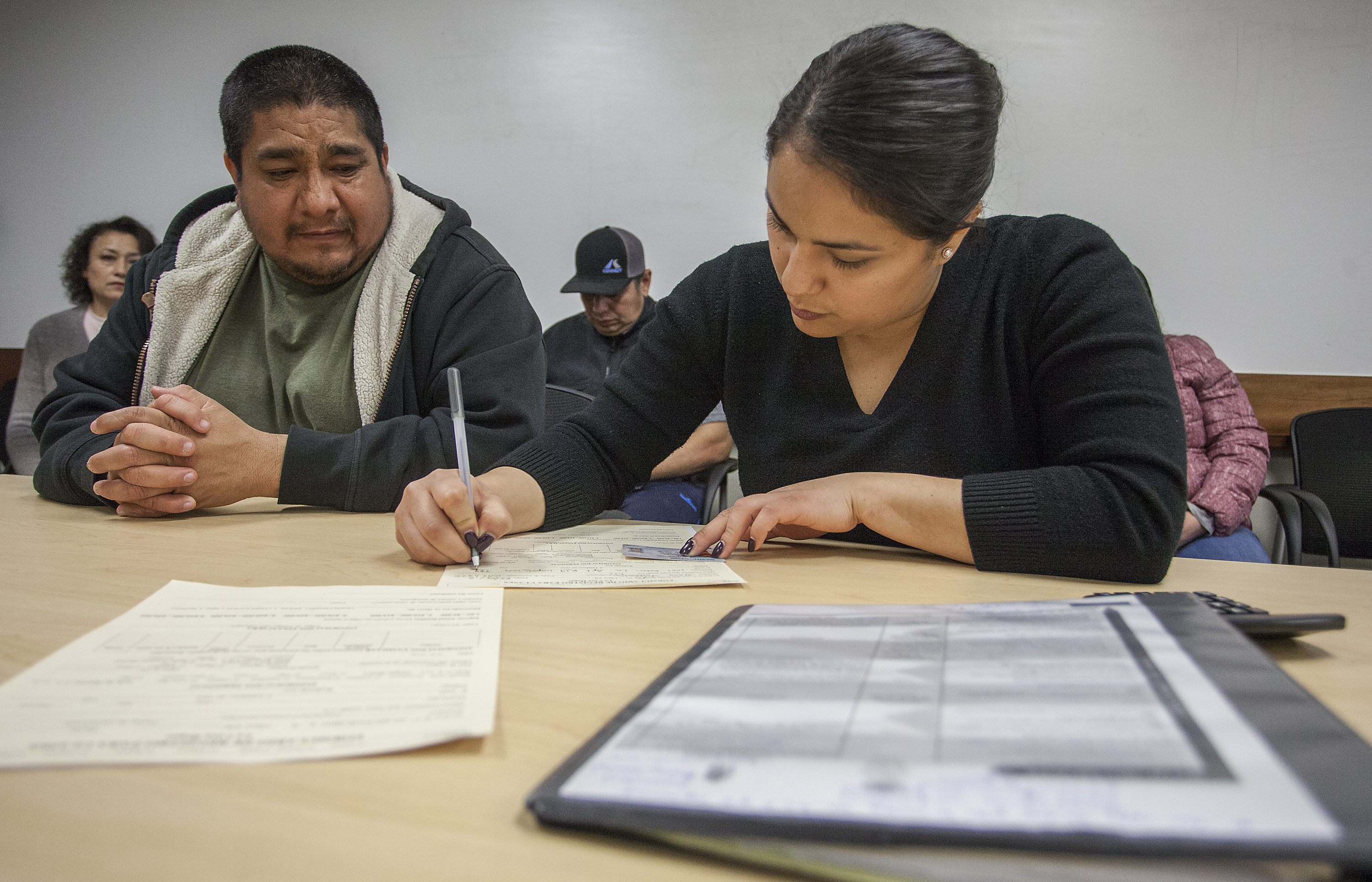 People register for citizenship classes offered by La Casa Hogar March 14, 2018 at the Yakima Valley Farmworkers Clinic in Toppenish, Wash. (GORDON KING/Gordon King Photography)